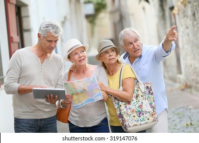 Group Of Senior People Traveling In Europe