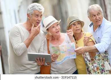 Group Of Senior People Traveling In Europe