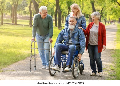 Group Of Senior People Walking In Park