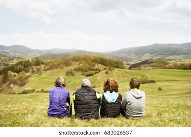 Group Of Senior Runners Outdoors, Resting. Rear View.