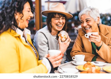 Group of senior women at bar cafeteria enjoying breakfast drinking coffee and eating croissant - Life style concept - Mature female having fun at bistrò cafe and sharing time together - Shutterstock ID 2270818529