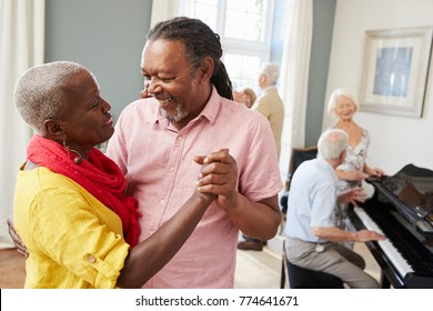 Group Of Seniors Enjoying Dancing Club Together