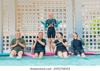 A group of seniors enjoys a lively water exercise class, led by an instructor at a poolside. They splash, laugh, and engage in fun activities, staying active and promoting health and wellness.