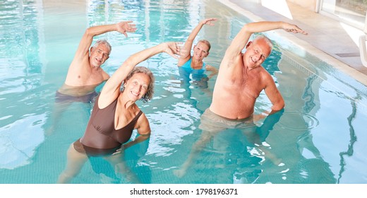 Group of seniors exercising their backs at aquafitness course in the pool by a swimming pool
