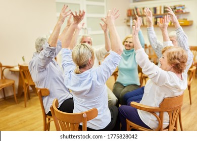 Group of seniors in old people's home doing sitting exercises or exercise therapy exercise - Powered by Shutterstock