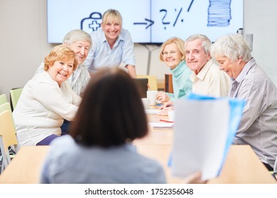 Group Of Seniors In A Retirement Seminar With An Investment Advisor