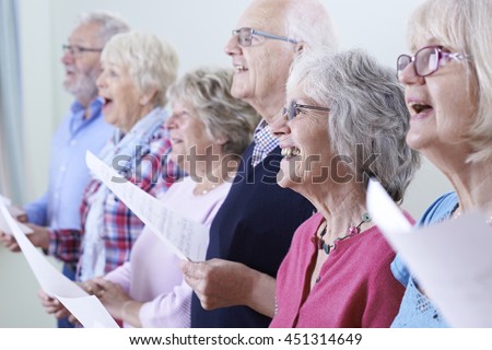 Group Of Seniors Singing In Choir Together