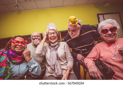 Group Of Seniors Taking Selfie In The Nursing House. Making Big Crazy Party