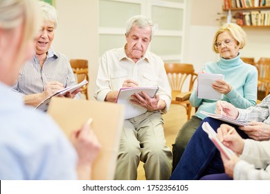 Group Of Seniors In Writing Therapy Or Painting Therapy In A Retirement Home