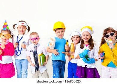 Group Of Seven Children Dressing Up As Professions
