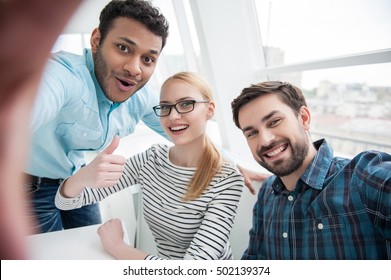 Group Shot Of Colleagues Having Fun In Their Office