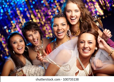 Group shot of young women celebrating their friend'??s forthcoming marriage, hen party