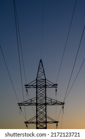 Group Silhouette Of Transmission Towers (power Tower, Electricity Pylon, Steel Lattice Tower) At Twilight In US