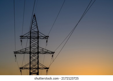 Group Silhouette Of Transmission Towers (power Tower, Electricity Pylon, Steel Lattice Tower) At Twilight In US