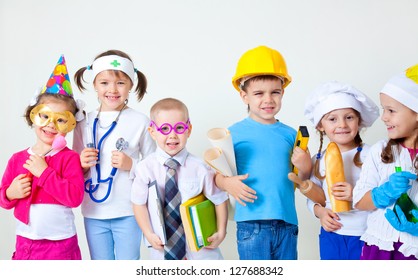 Group Of Six Children Dressing Up As Professions