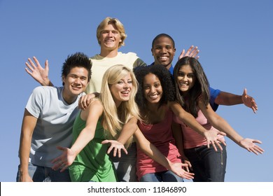 Group Of Six Friends Having Fun Outside