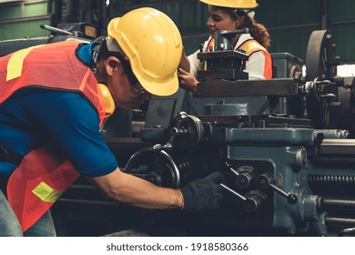 Group of skillful workers using machine equipment in factory workshop . Industry and engineering people technology concept . - Powered by Shutterstock - Get 15% off with code: PIKWIZARD15