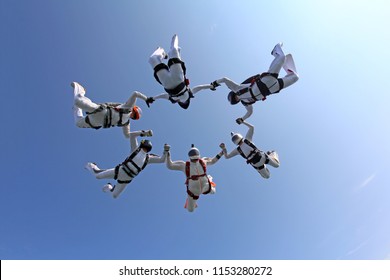 Group Skydiving In The Summer Sky.