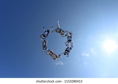 Group Skydiving In The Summer Sky.