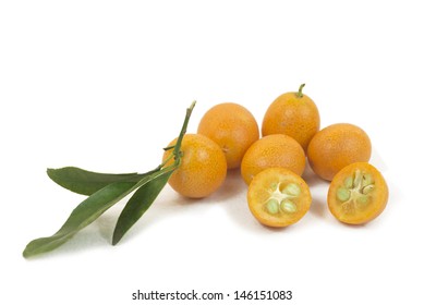 A group of small kumquats or cumquats or fortunella, isolated over white background