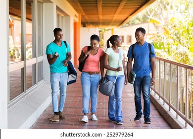 group of smart college students walking to lecture hall