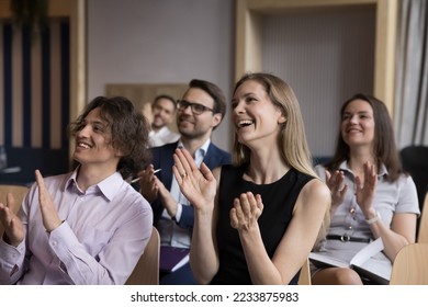 Group of smiling businesspeople welcoming corporate trainer, express gratitude to business coach after educational seminar in office conference room, clap hands showing appreciation for received skill - Powered by Shutterstock