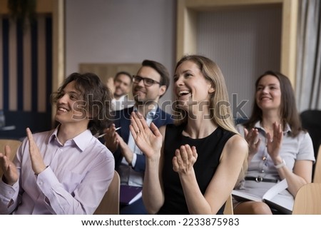 Group of smiling businesspeople welcoming corporate trainer, express gratitude to business coach after educational seminar in office conference room, clap hands showing appreciation for received skill