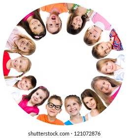 Group Of Smiling Kids Standing In Huddle On White Background