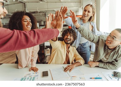 Group of smiling multiracial business people giving five high celebration success, working in modern office. Startup, meeting, teamwork. Successful business, career  - Powered by Shutterstock