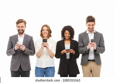 Group Of Smiling Young Business People Using Mobile Phones Isolated Over White Background