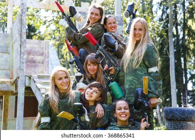 Group Of Smiling Young Girls With Paintball Ammunition