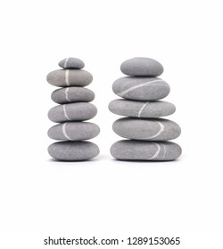 Group of smooth grey and white stones. Sea pebble. Stacked pebbles isolated on white background


