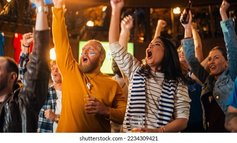 Group of Soccer Fans with Colored Faces Watching a Live Football Match in a Sports Bar. People Cheering for Their Team. Player Scores a Goal and Crowd Celebrate Winning the Championship. - Powered by Shutterstock