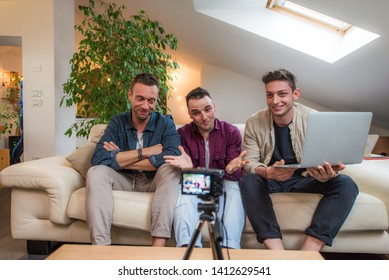Group of social network influencers filming a vlog at home, talking and reviewing a product