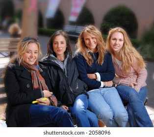 Group Of Sorority Girls Sitting On Bench