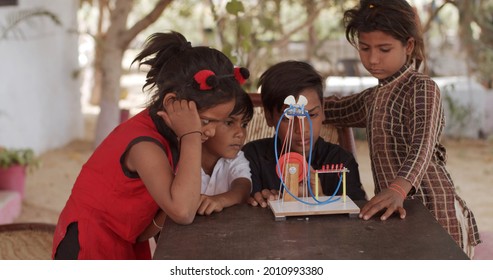 A Group Of South Asian Children Playing With Educational Toys