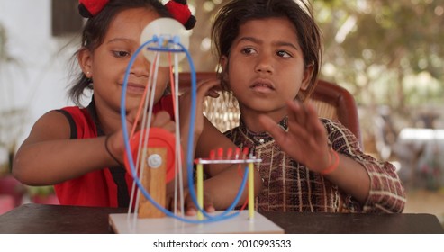 A Group Of South Asian Children Playing With Educational Toys