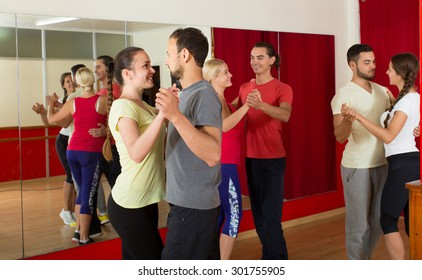 Group Of Spanish  People Dancing Rumba In Studio