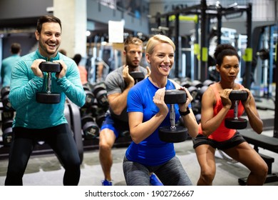 Group Of Sportive People In Gym. Happy Fit Friends Workout, Exercise In Fitness Club