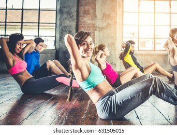 Group Of Sportive People Training In A Gym - Multi-ethnic Group Of Athletes Doing Fitness