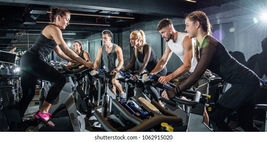 Group Of Sporty People On Cycling Class