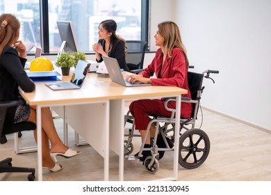 Group Of Startup Business Co-worker Working In Office With Disability Staff Sitting On Wheelchair As A Professional One Team Together