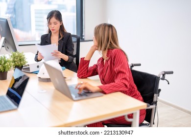 Group Of Startup Business Co-worker Working In Office With Disability Staff Sitting On Wheelchair As A Professional One Team Together