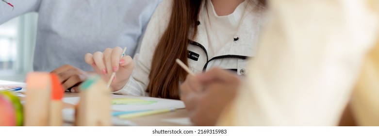 Group of student sitting and studying and learning drawing with teacher together in classroom at the school, pupils creativity and development for drawing in course, back to school, education concept. - Shutterstock ID 2169315983