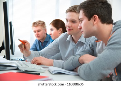 Group Of Students Attending Training Course In A Computer Classroom