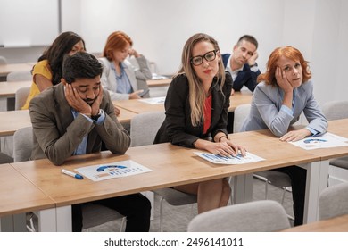 Group of students from a business training master's degree bored and tired of so many presentations