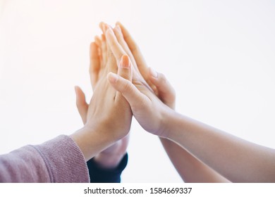 Group of students or businessman hands together joining for teamwork, community,  togetherness and business collaboration concept. - Shutterstock ID 1584669337