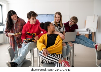 Group of students in classroom studying robotics. - Powered by Shutterstock