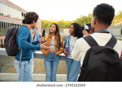 Group of students creating media content by interviewing a peer on campus
