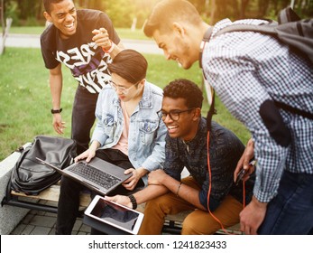 A Group Of Students From Different Countries Communicate After Classes On The Street In The Campus. The Photo Illustrates Student Life, Education At University Or College.